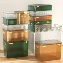 Multi-purpose household storage box set in green, brown, and clear colors with handles for easy organizing