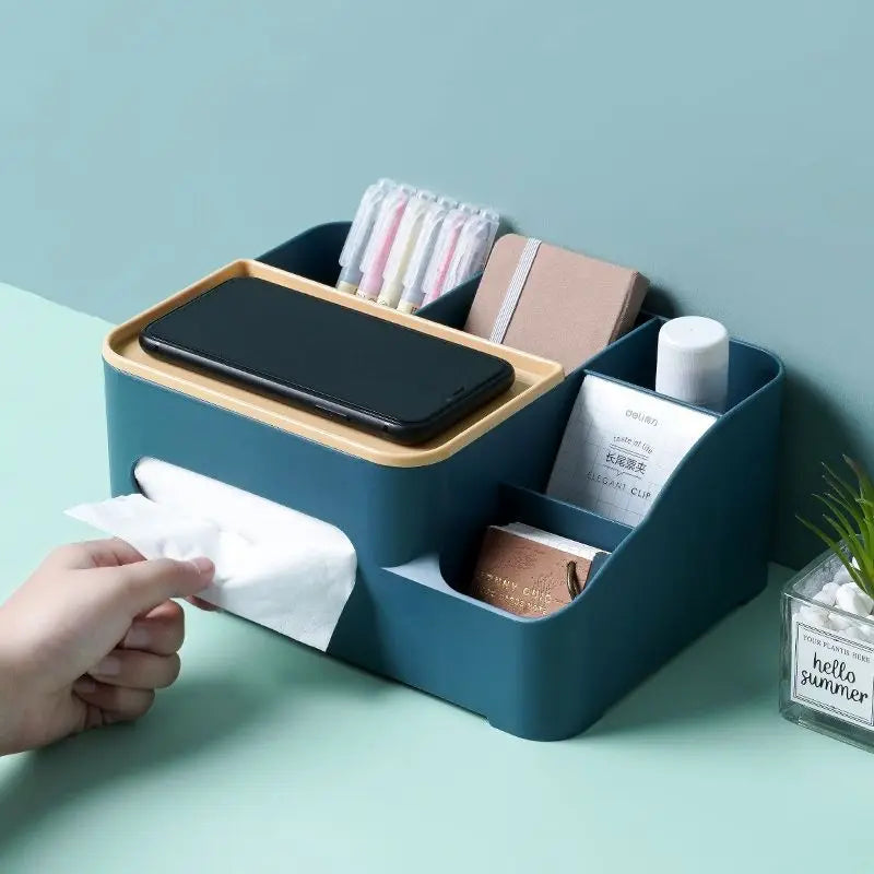 Blue multifunctional organizer for desk with compartments holding phone, tissues, pens, and small boxes