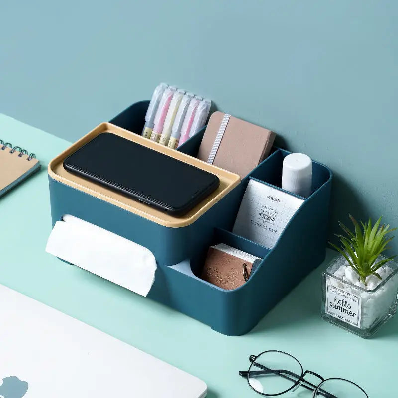Clarify.pk multifunctional organizer for desk in blue holding smartphone, pens, notebook, and small items