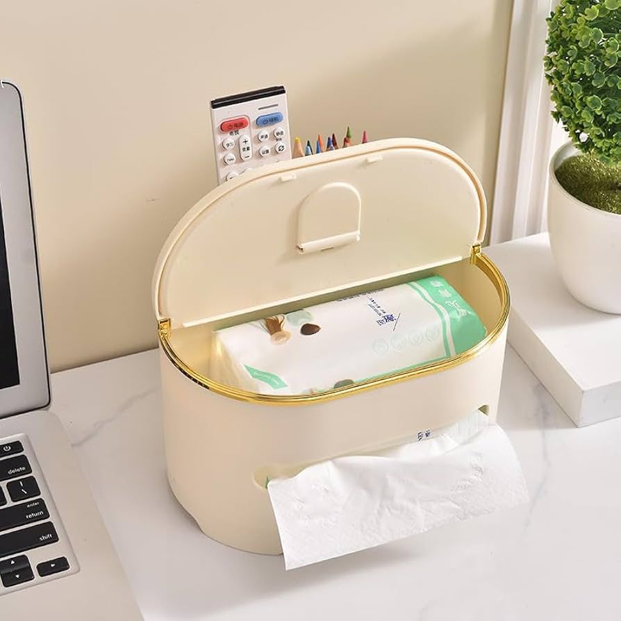 Cream-colored multifunctional tissue box with gold trim holding tissue pack on a white desk