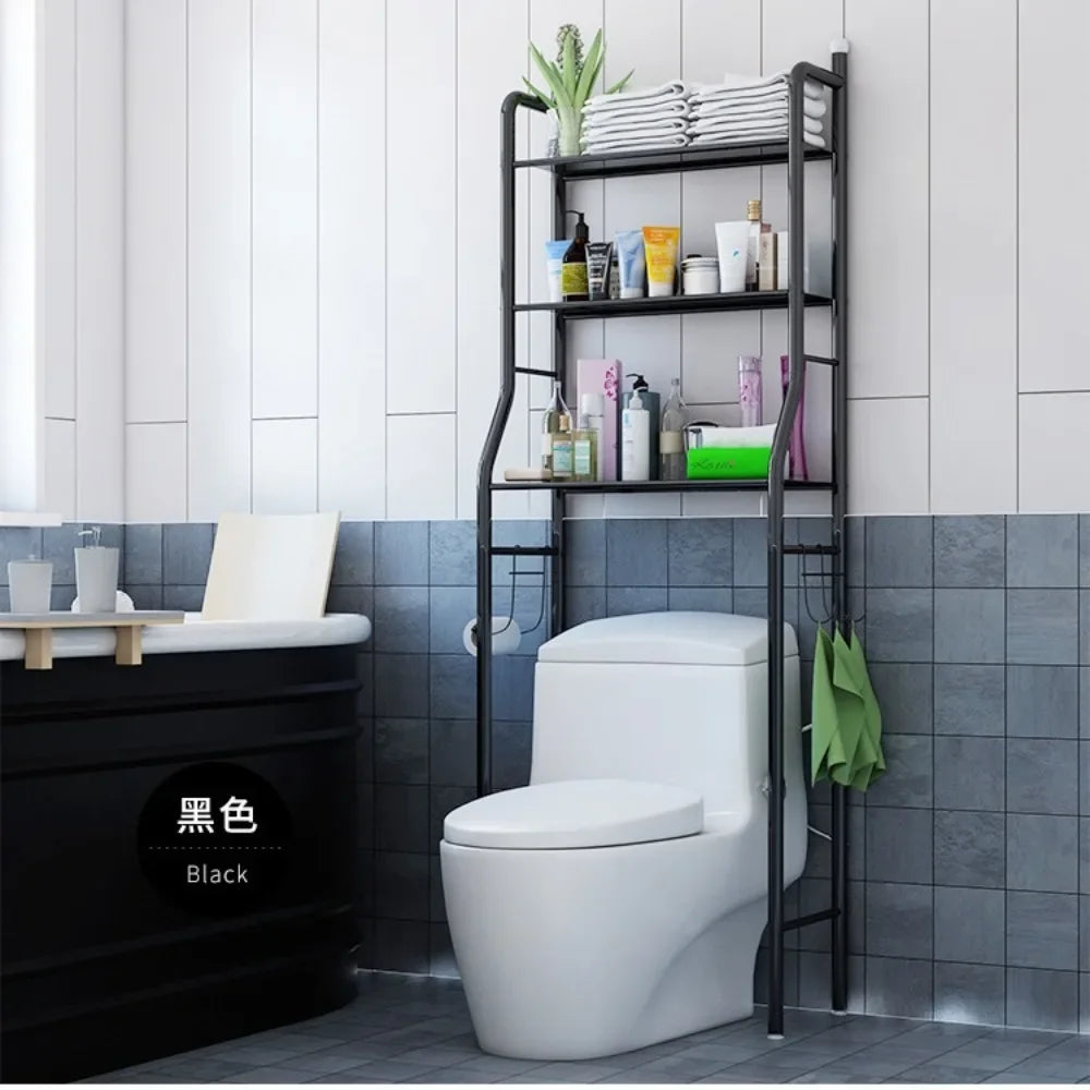 Black multifunctional toilet rack over white toilet holding towels and toiletries in modern bathroom