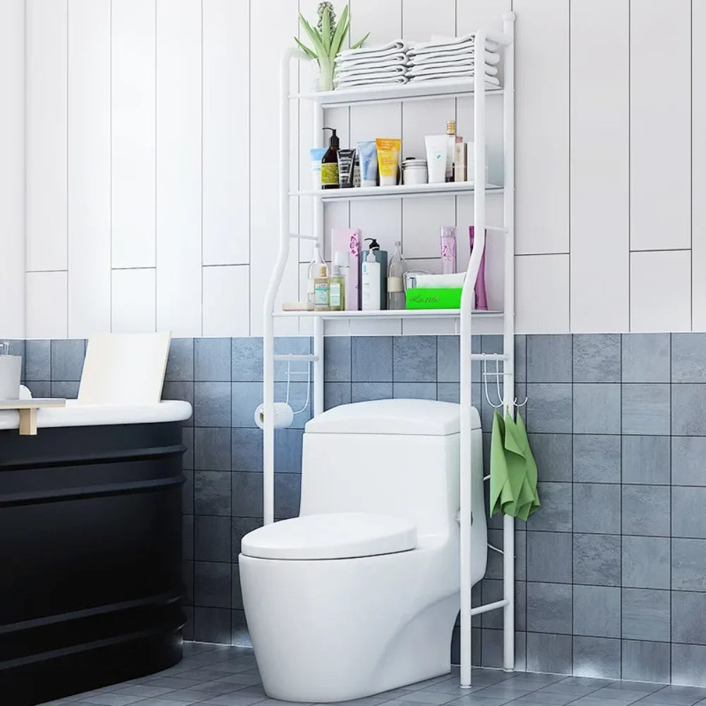 White multifunctional toilet rack with shelves holding toiletries and towels above a modern toilet