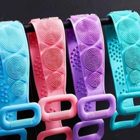 Colorful silicone body scrubber straps with textured scrub surfaces and handles hanging on a rod