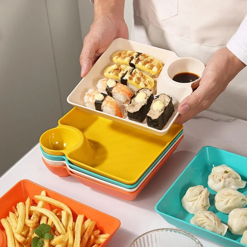 Clarify.pk multipurpose snack plates with sauce compartment holding sushi and dumplings with colorful plate stack