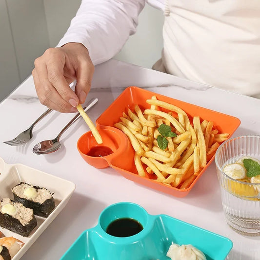Orange dumpling plate serving french fries with sauce in multipurpose snack plates with sauce compartment