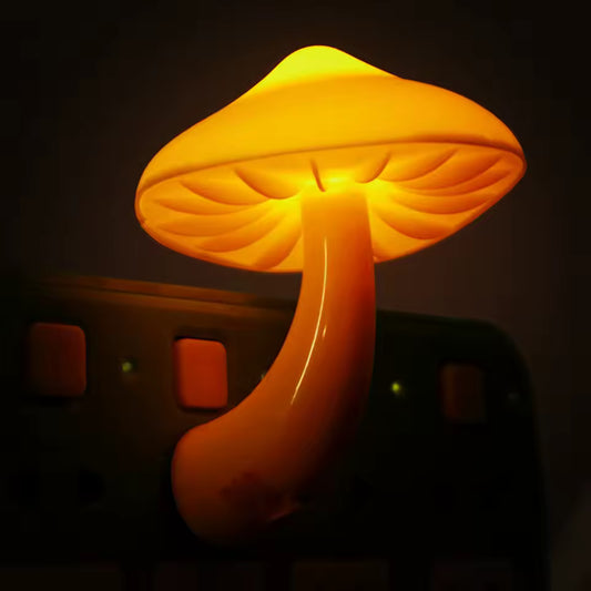 Clarify.pk mushroom night light LED glowing warm yellow light plugged into power strip