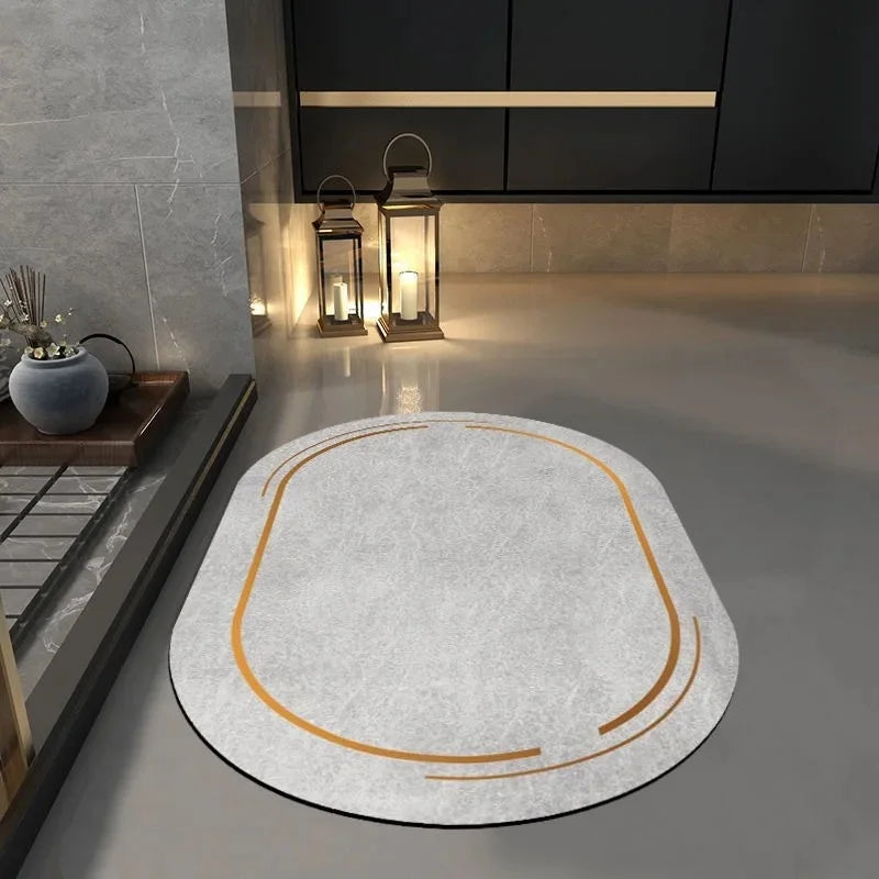 Gray non slip bathroom mat with orange trim placed on modern bathroom floor near candles and cabinet