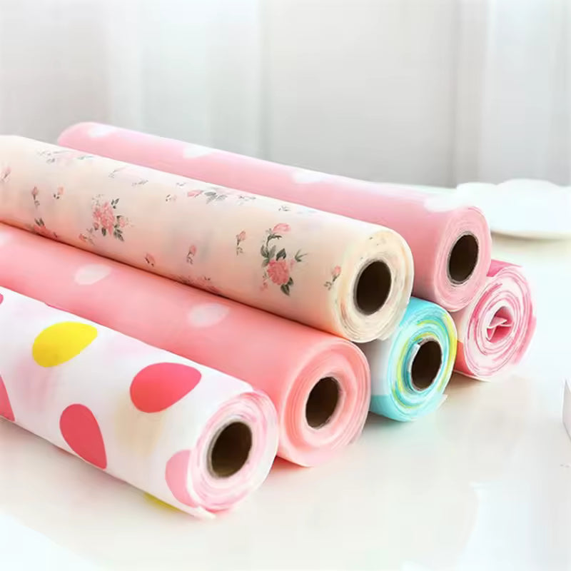 Colorful rolls of non-slip cabinet mat for drawers with floral and polka dot patterns for drawer protection