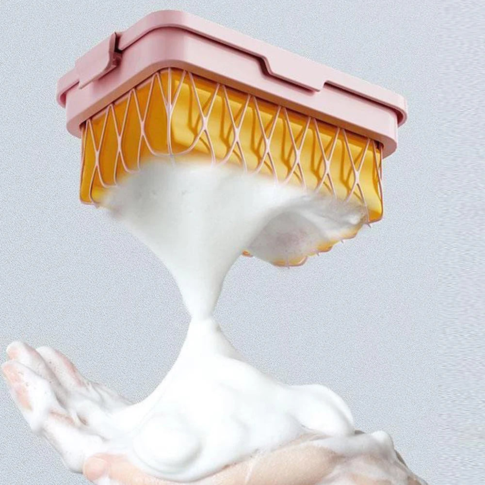 Non slip soap holder in pink and yellow dispensing thick foam onto hands from Home Decor Store Store