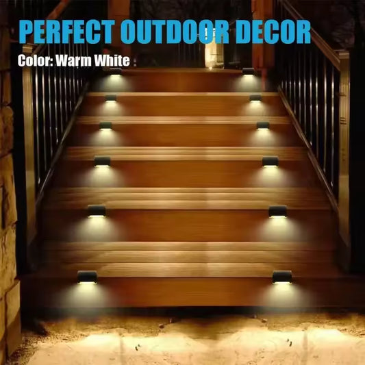 Pack of 4 solar led staircase lights outdoor installed on wooden stairs with warm white light