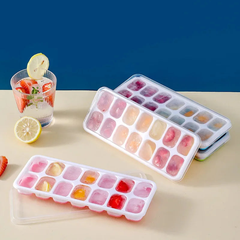 Clarify.pk 14 grid silicone ice cube mold with colorful frozen fruit ice cubes in clear trays