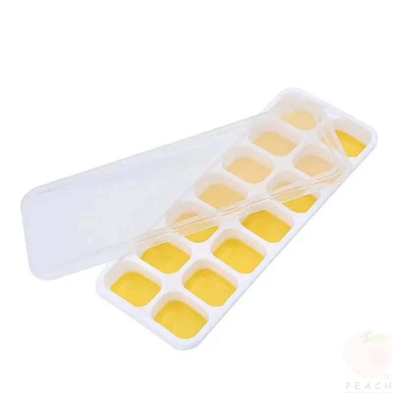 Clarify.pk 14 grid silicone ice cube mold filled with yellow liquid and a transparent lid
