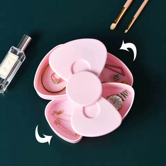 Pink 360 degree bow rotating jewelry box by Clarify.pk with multiple compartments for rings and watches