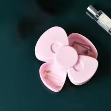 Pink 360 degree bow rotating jewelry box by Clarify.pk with compact compartments for rings