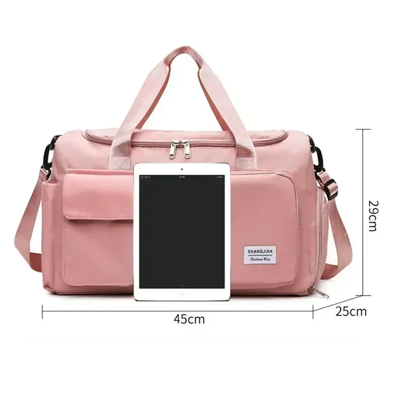 Pink large capacity travel bag with multiple pockets and adjustable shoulder strap