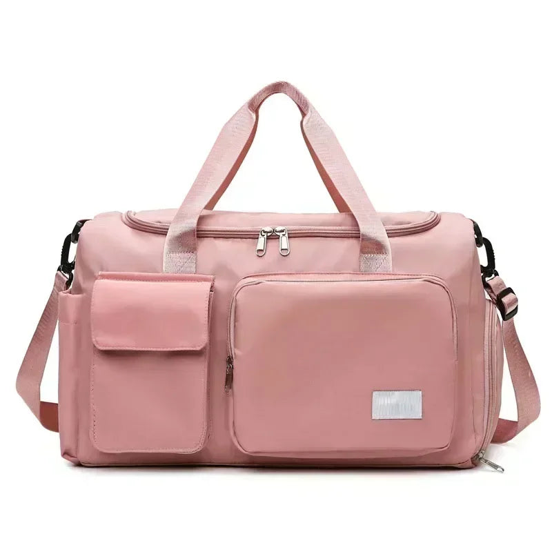 Pink large capacity travel bag with multiple front pockets and adjustable shoulder strap