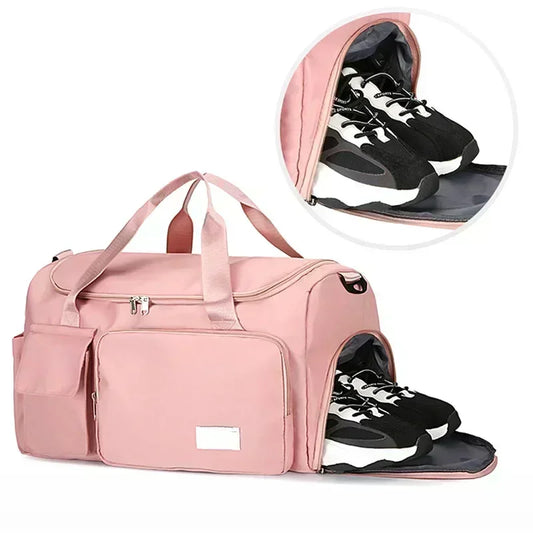 Pink large capacity travel bag with separate shoe compartment and multiple zippered pockets