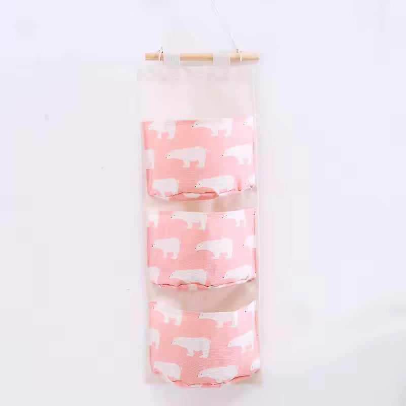 Clarify.pk hanging wall storage organizer with three pink pockets featuring white polar bear prints