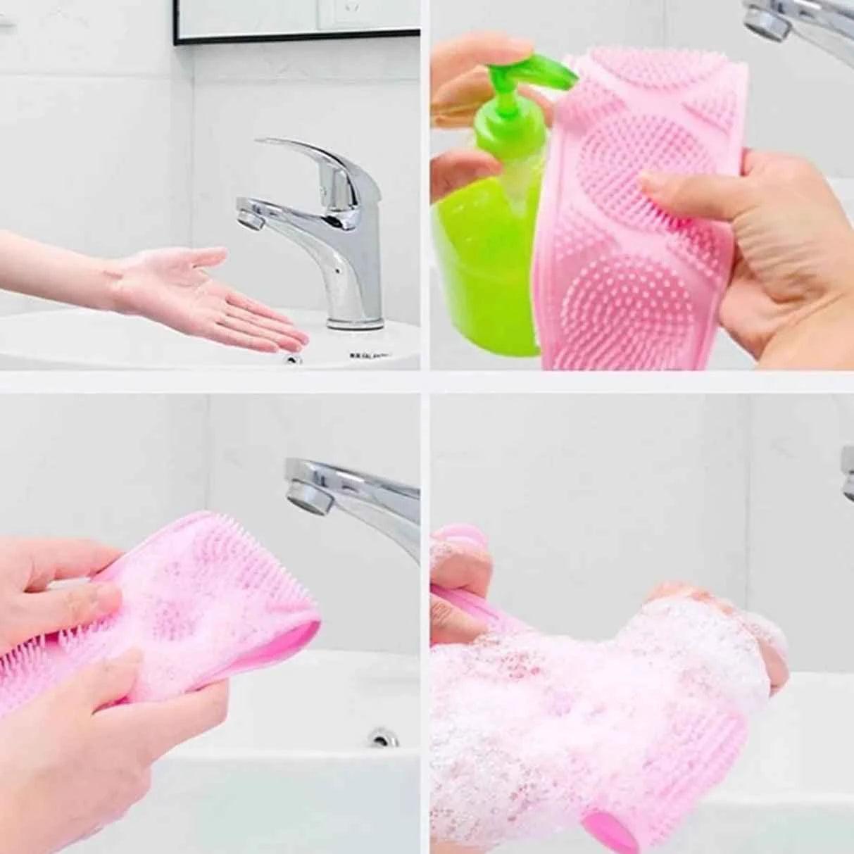 Pink silicone body scrubber being used with soap and water for gentle skin exfoliation