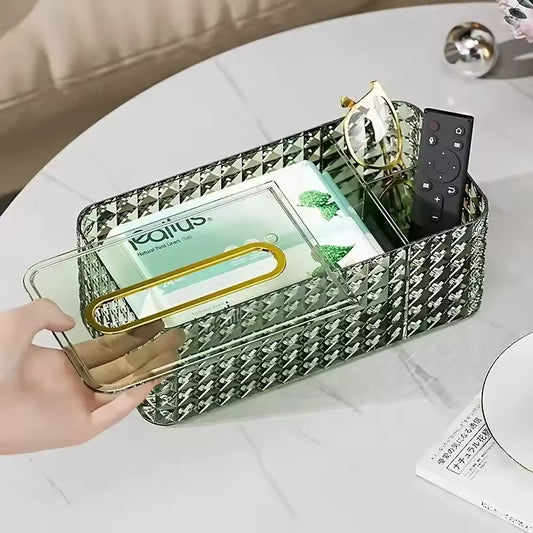 Clarify.pk plastic tissue organizer box with a transparent lid holding tissues, glasses, and a remote control