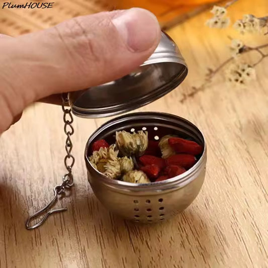 Clarify.pk stainless steel tea leaves diffuser ball with chain filled with dried flowers and herbs