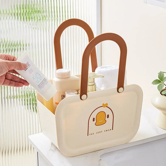 Clarify.pk portable bathroom storage basket in cream with brown handles holding toiletries