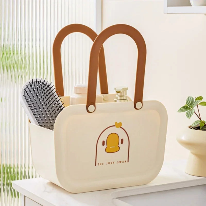 Clarify.pk portable bathroom storage basket with brown handles and cute duck design holding toiletries and brush