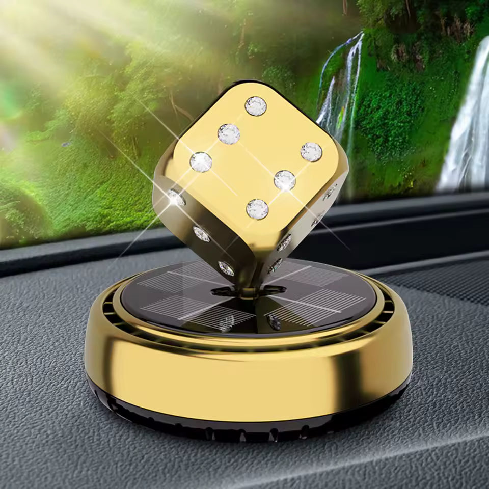 Gold portable car air purifier with spinning dice design on car dashboard by Clarify.pk