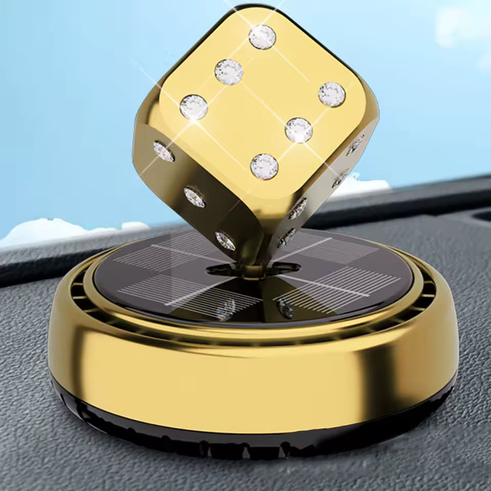 Gold portable car air purifier with rotating dice design and solar panel base on car dashboard