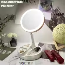 Clarify.pk portable double-sided vanity mirror with LED light and USB battery power on a white stand