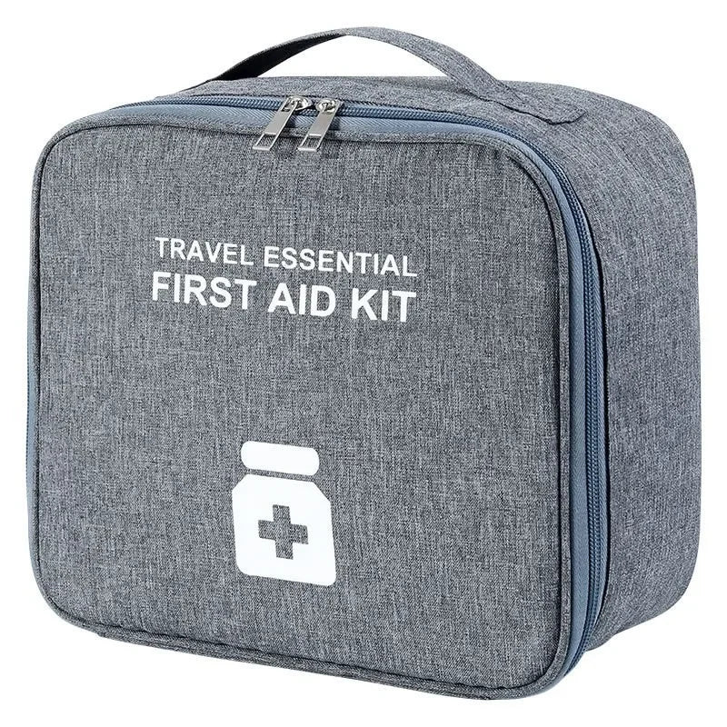 Gray travel essential portable first aid kit bag with zipper closure and handle for easy carrying