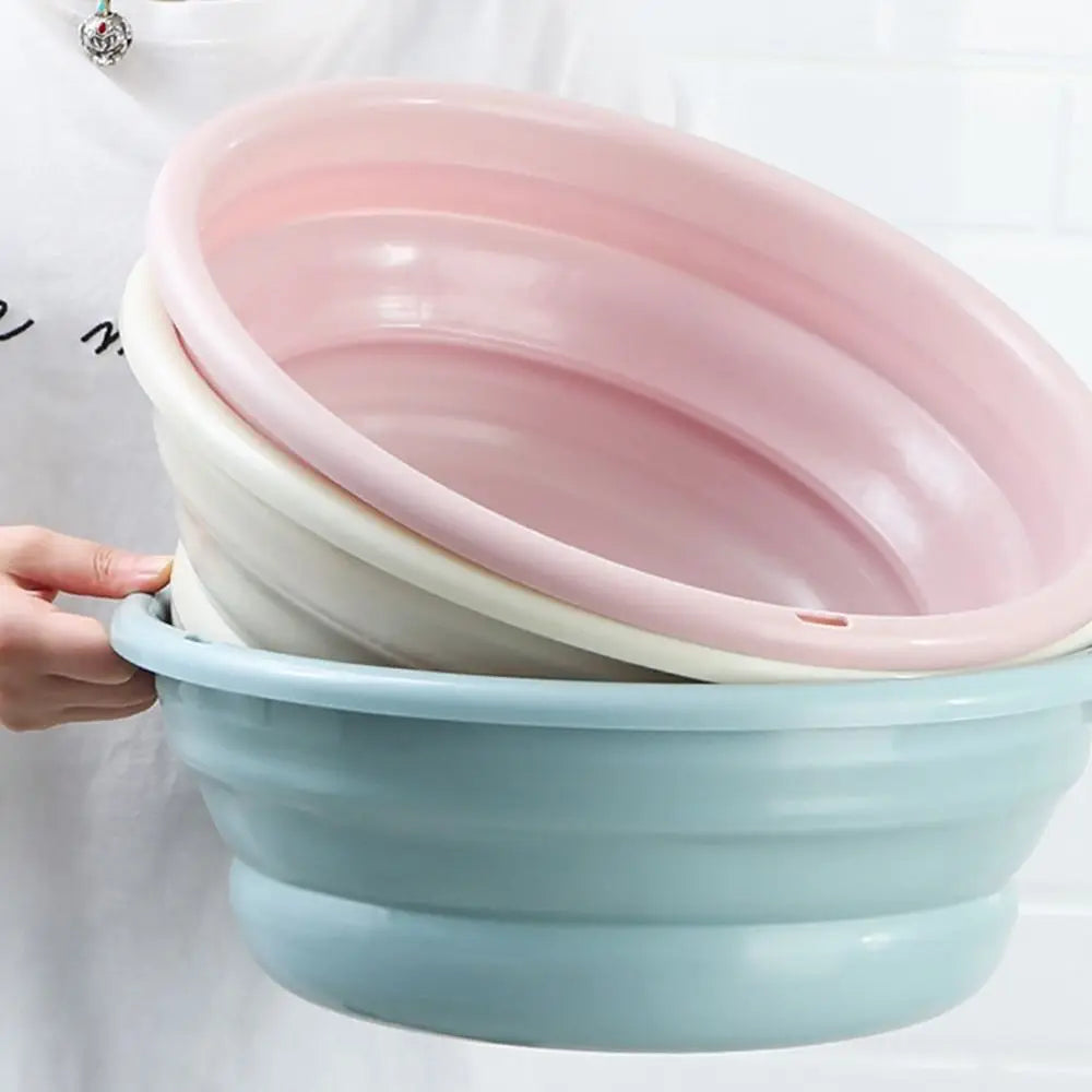 Clarify.pk portable folding laundry tub in pastel colors held by a person for easy laundry use