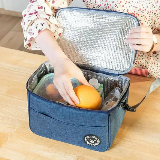 Portable insulated lunch bag in blue oxford cloth by Clarify.pk with spacious insulated interior