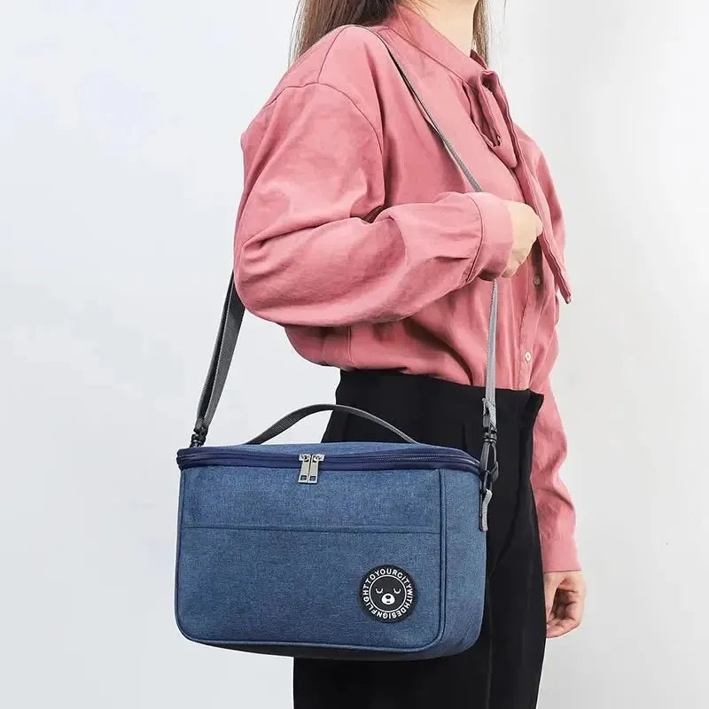 Clarify.pk portable insulated lunch bag in blue oxford cloth with shoulder strap and zipper closure
