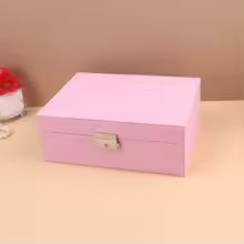 Portable jewelry box for girls in pink with secure lock and compact design