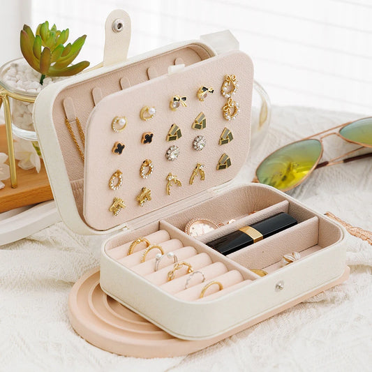 Clarify.pk portable jewelry storage box in beige with compartments for rings, earrings, and necklaces