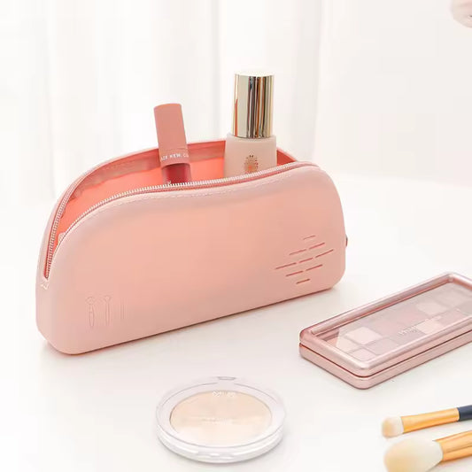 Clarify.pk pink silicone cosmetic bag as a portable makeup organizer with zipper closure