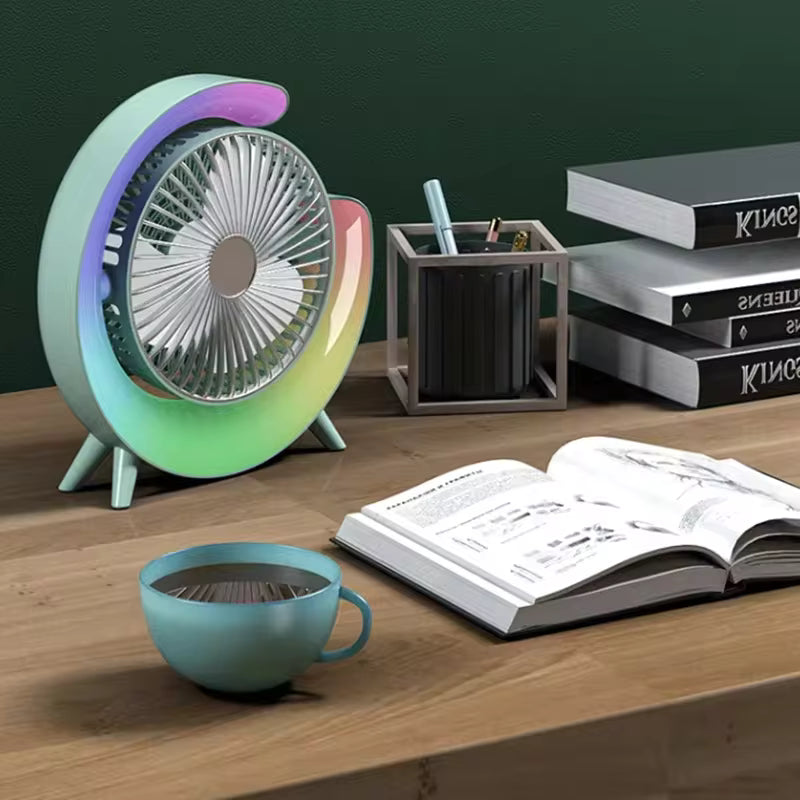 Clarify.pk portable marquee fan with night light glowing in multiple colors on a wooden desk