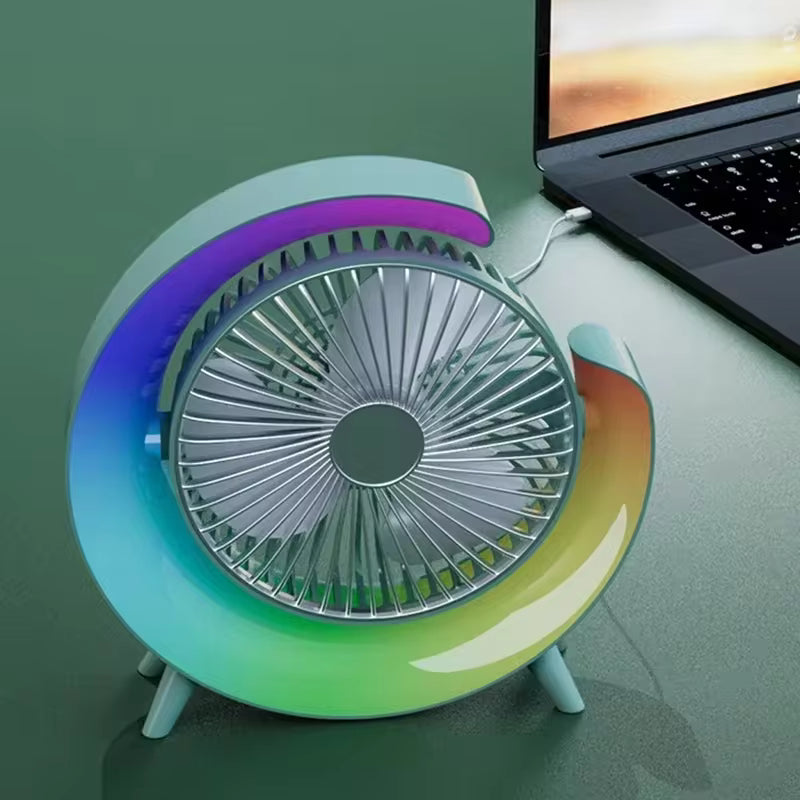 Clarify.pk portable marquee fan with night light in blue and green gradient design next to a laptop