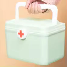 Portable medicine chest with handle in light green featuring a red cross symbol on the front