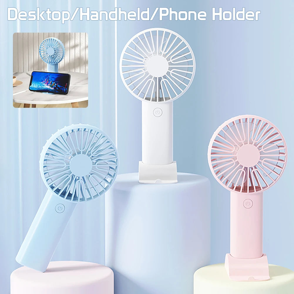 Clarify.pk portable mini fan USB rechargeable in blue, white, and pink with desktop and phone holder