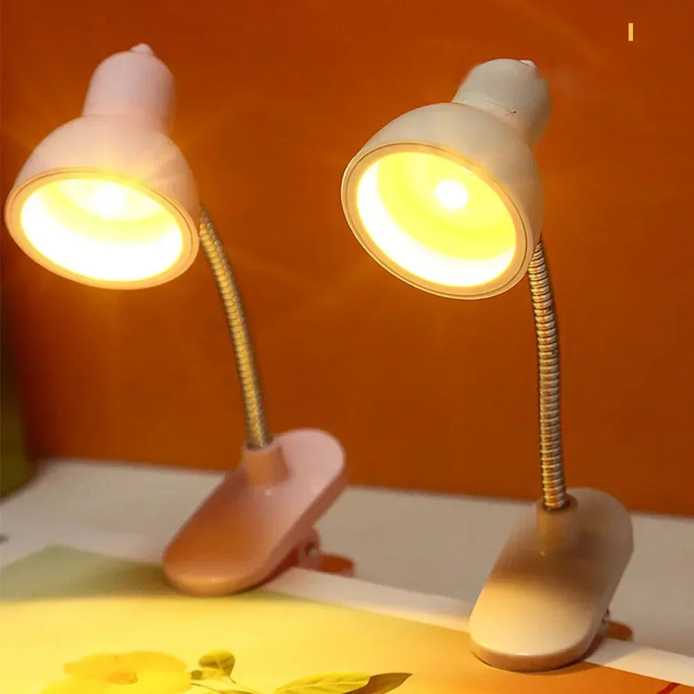 Clarify.pk white portable mini night light with flexible neck and clip base illuminating a workspace