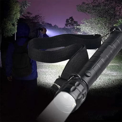 Portable outdoor flashlight for camping with black strap and bright light beam at night