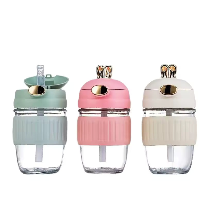 Clarify.pk portable rabbit water bottle set with green, pink, and beige lids featuring bunny ears and reusable straw