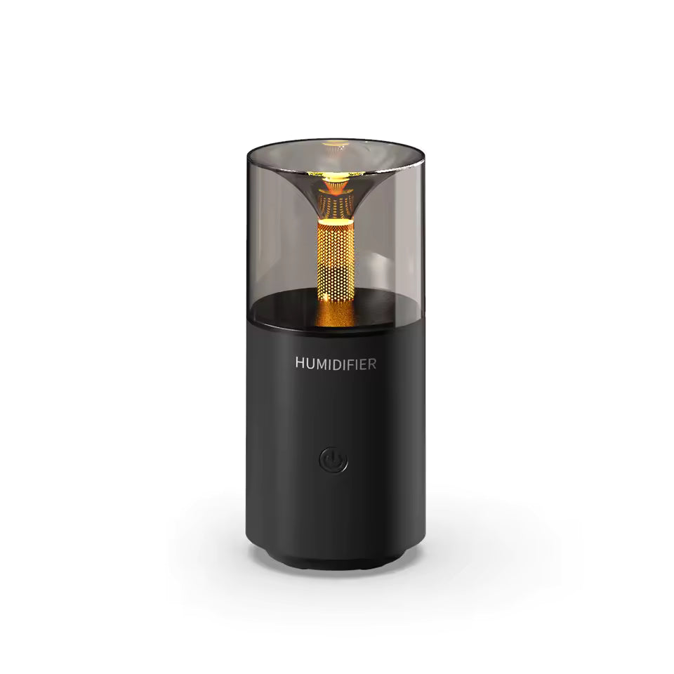 Black portable USB aroma humidifier with sleek modern design and amber light inside