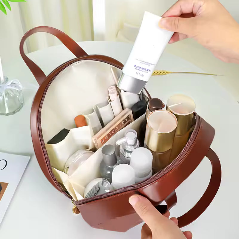 Brown PU leather cosmetic bag for women open with organized makeup and skincare products inside