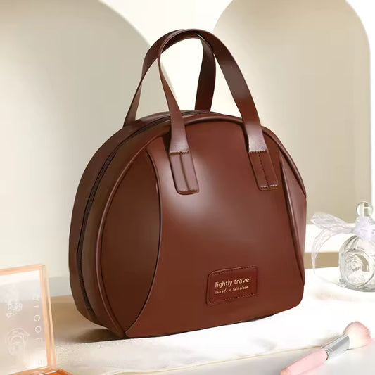 Brown PU leather cosmetic bag for women with double handles and sleek curved design