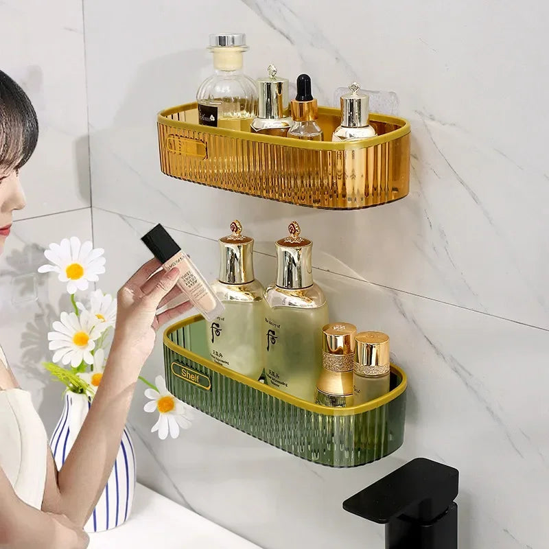 Punch-free bathroom shelf in amber and green plastic holding toiletries on bathroom wall