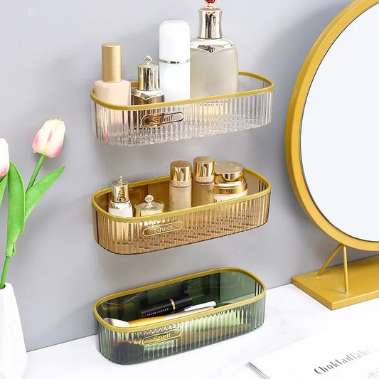 Clarify.pk plastic punch-free bathroom shelf set with gold trim holding toiletries mounted on wall