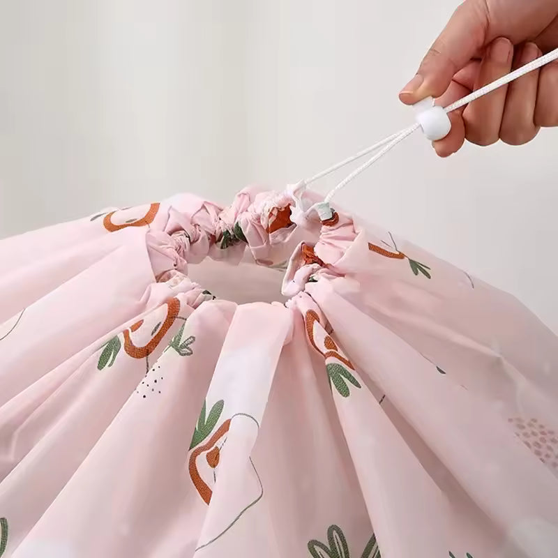 Pink quilt storage bag for clothes with floral print and drawstring closure by Clarify.pk